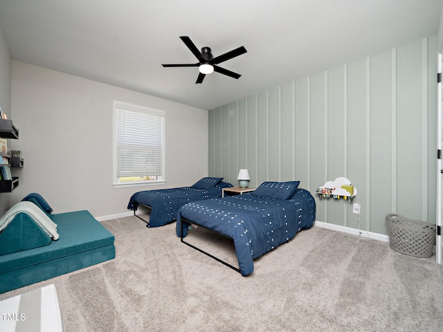 carpeted bedroom with a ceiling fan and baseboards