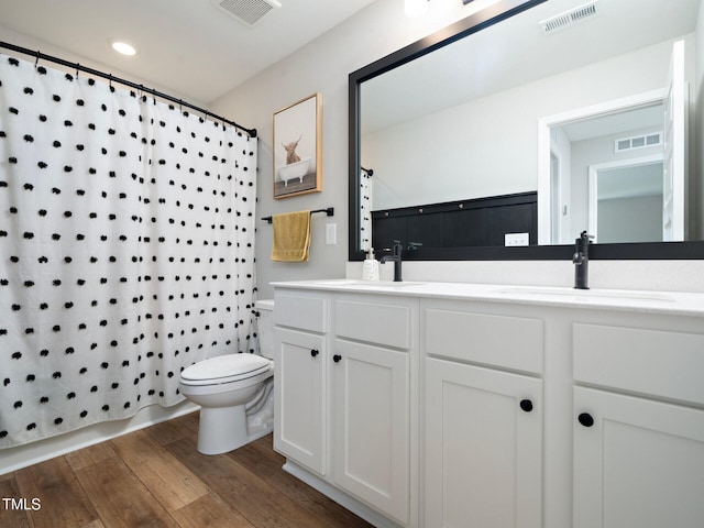 full bathroom with a sink and visible vents