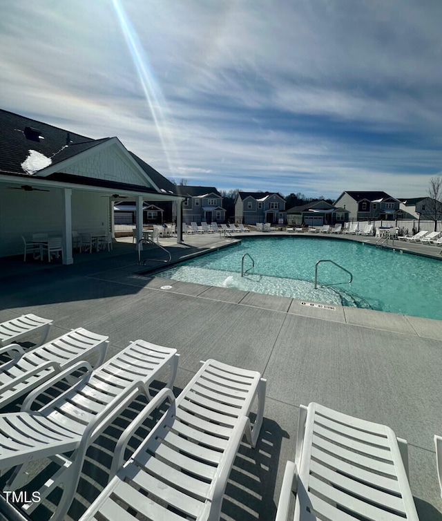 community pool featuring a patio area