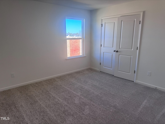 unfurnished bedroom with carpet