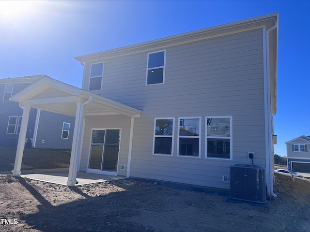 back of house featuring central air condition unit and a patio