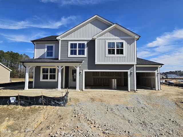 view of front of property with a garage and a porch