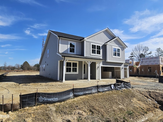 view of front of home with a garage and covered porch