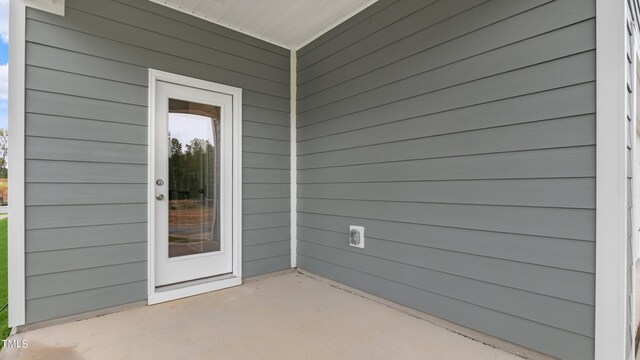 doorway to property featuring a patio area