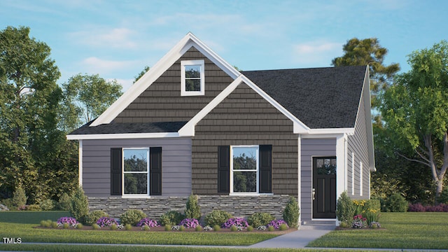 view of front of home with stone siding and a front yard