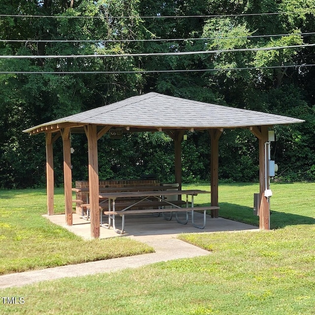 view of property's community featuring a lawn and a gazebo