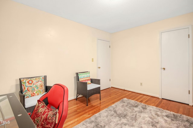 living area with light hardwood / wood-style flooring