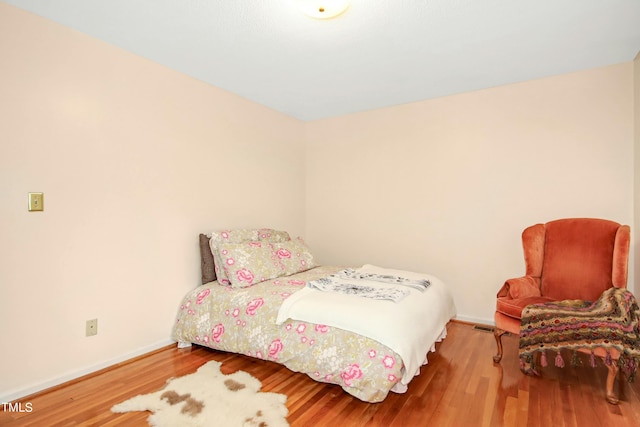 bedroom featuring hardwood / wood-style floors