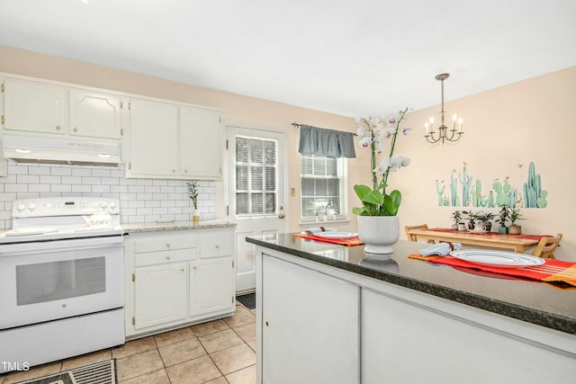 kitchen featuring white cabinets, decorative light fixtures, backsplash, and white electric stove