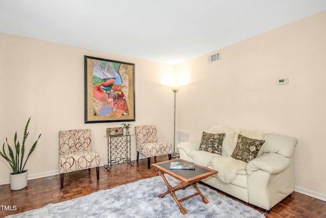 living room featuring parquet floors