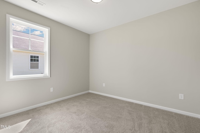 empty room featuring carpet flooring