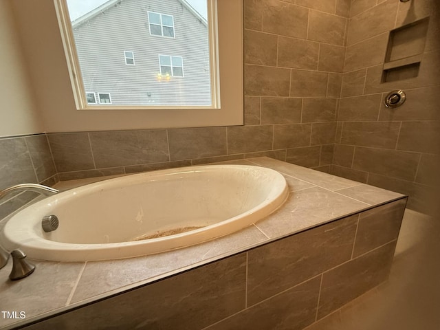 bathroom featuring a relaxing tiled tub