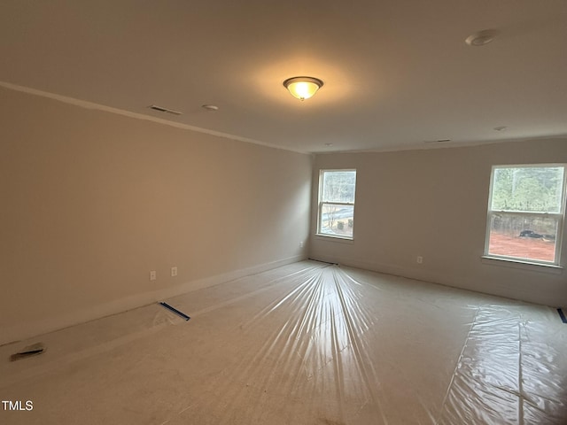 spare room featuring ornamental molding