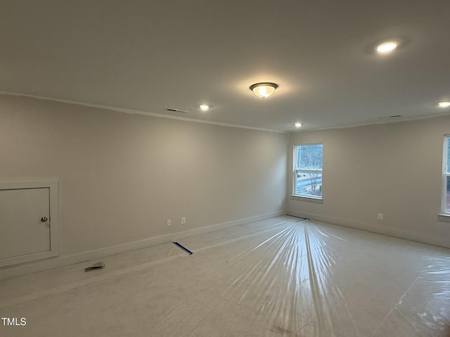 unfurnished room featuring ornamental molding