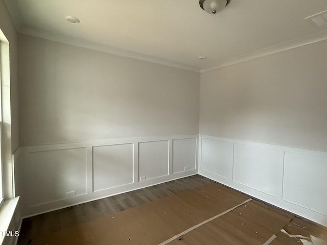 unfurnished room featuring dark hardwood / wood-style flooring and crown molding