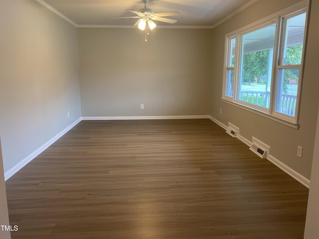 empty room with ornamental molding, ceiling fan, and dark hardwood / wood-style floors