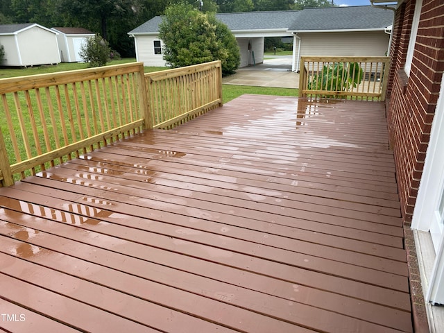 deck featuring a yard and a shed