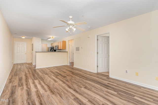 unfurnished living room with ceiling fan and light hardwood / wood-style flooring