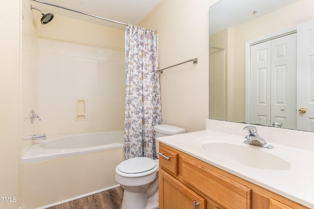 full bathroom with vanity, toilet, shower / bath combo with shower curtain, and hardwood / wood-style flooring