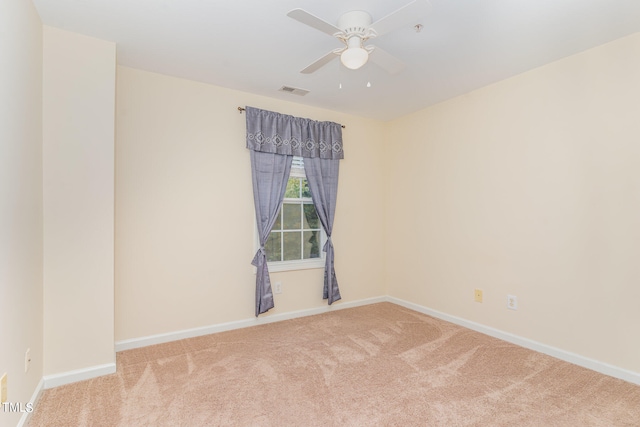 empty room with carpet floors and ceiling fan