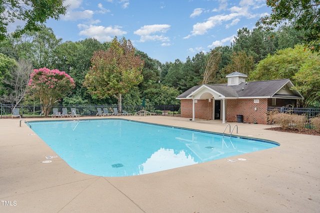 view of swimming pool with a patio