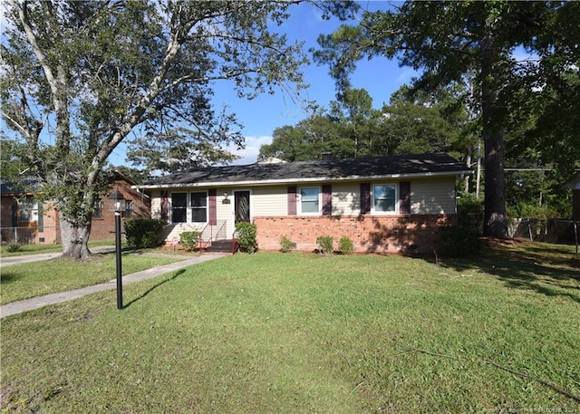 ranch-style home with a front lawn