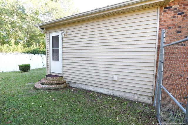 view of home's exterior with a yard