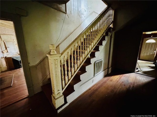 stairway featuring hardwood / wood-style floors