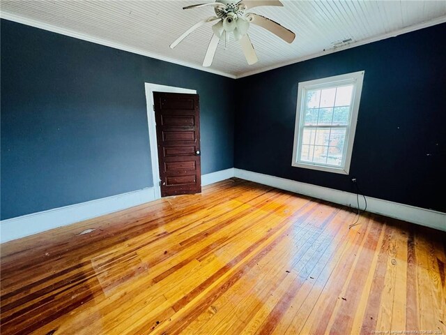 unfurnished room featuring ornamental molding, ceiling fan, and hardwood / wood-style floors