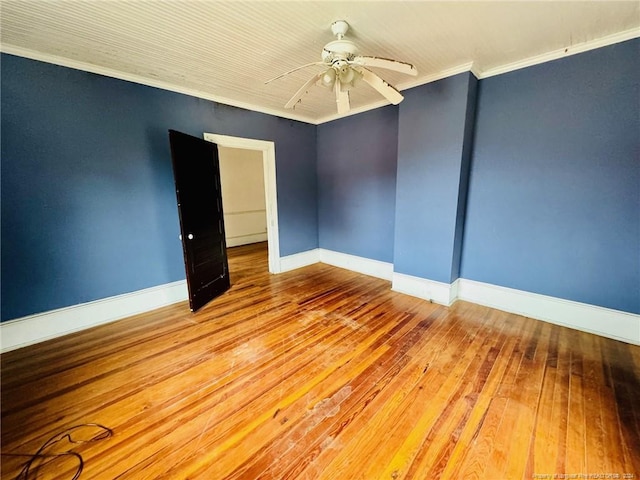 unfurnished room with ceiling fan, light wood-type flooring, and crown molding