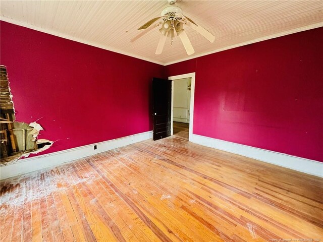 unfurnished room with crown molding, hardwood / wood-style floors, and ceiling fan