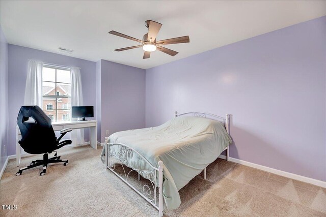 bedroom with light carpet and ceiling fan