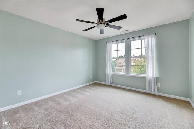 unfurnished room featuring carpet and ceiling fan