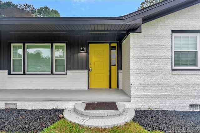 doorway to property featuring a porch