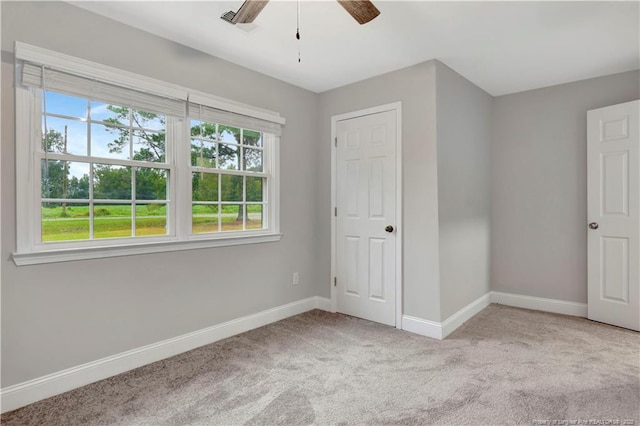 unfurnished bedroom featuring light carpet and ceiling fan