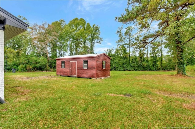 view of outbuilding with a lawn