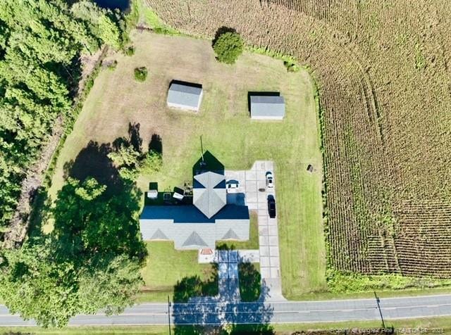 birds eye view of property featuring a rural view