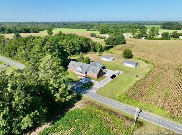 birds eye view of property with a rural view