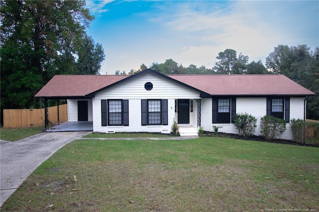 ranch-style home featuring a front yard and a carport