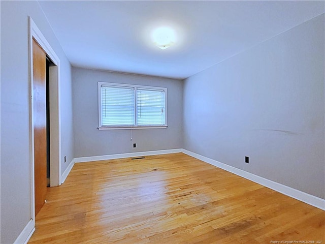 spare room with light wood-type flooring