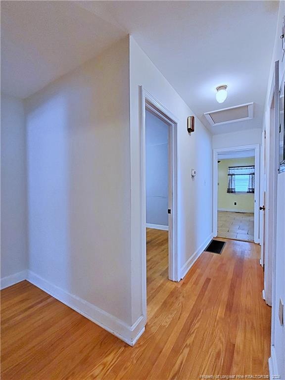 hall with light wood-type flooring