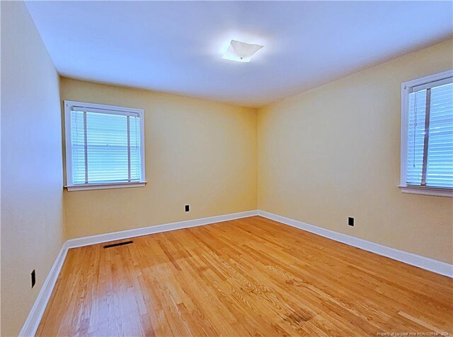 unfurnished room featuring light wood-type flooring