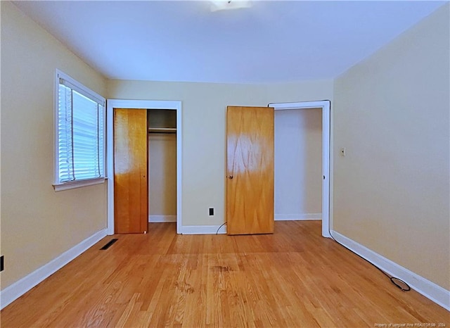 unfurnished bedroom with light hardwood / wood-style floors