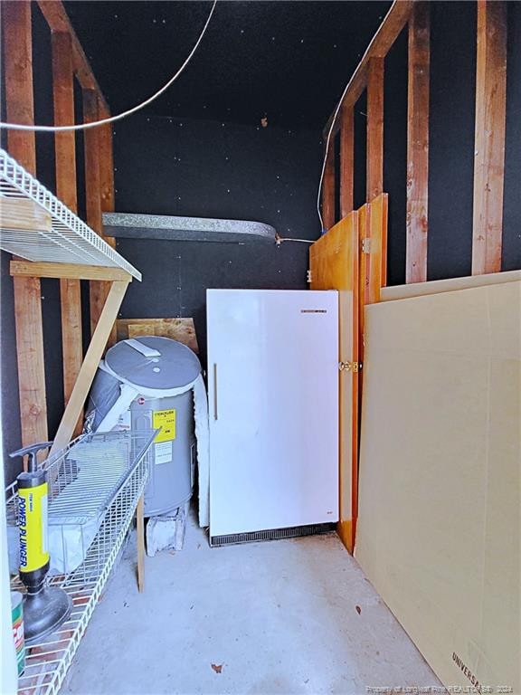 basement featuring white refrigerator