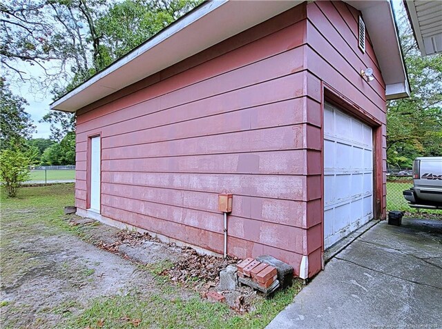 view of property exterior featuring a garage