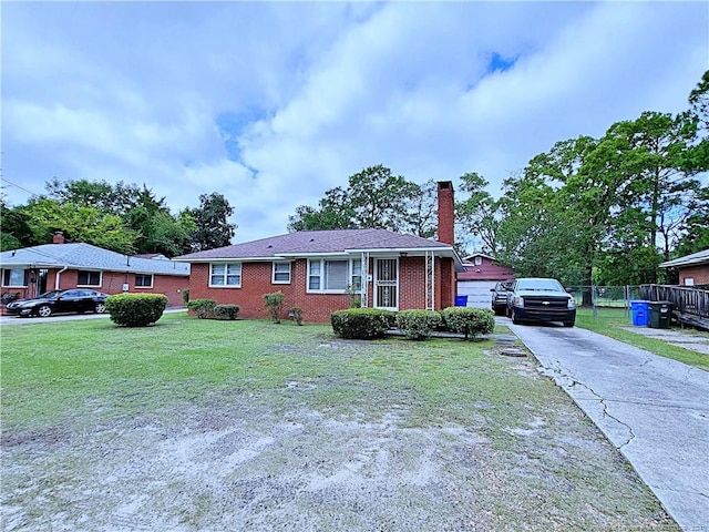 view of front of property with a front lawn and a garage