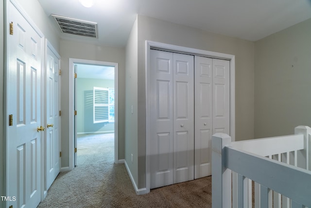 carpeted bedroom featuring a closet