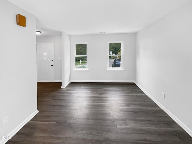 empty room featuring dark hardwood / wood-style floors