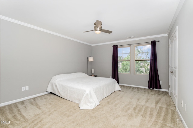 carpeted bedroom with crown molding and ceiling fan