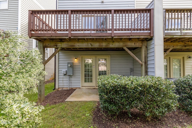 doorway to property with a deck and a patio area